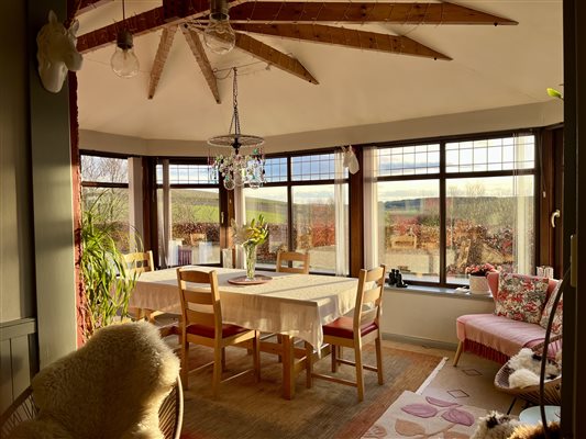 The sun lounge with dining table and spectacular views